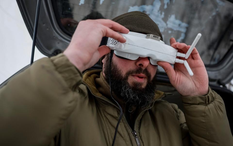 A Ukrainian serviceman of the "Achilles" Attack Drone Battalion prepares a first-person view (FPV) drone goggles  during a practice