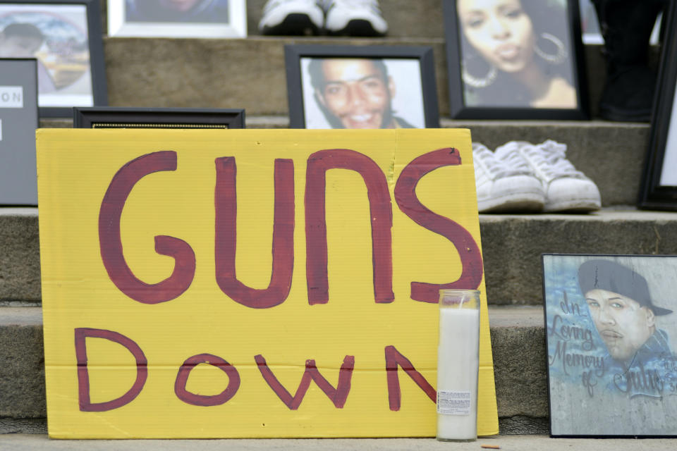 Photos and shoes of gun violence victims at a anti-gun rally on the Art Museum steps, in Philadelphia, on June 11, 2018. | Bastiaan Slabbers—NurPhoto