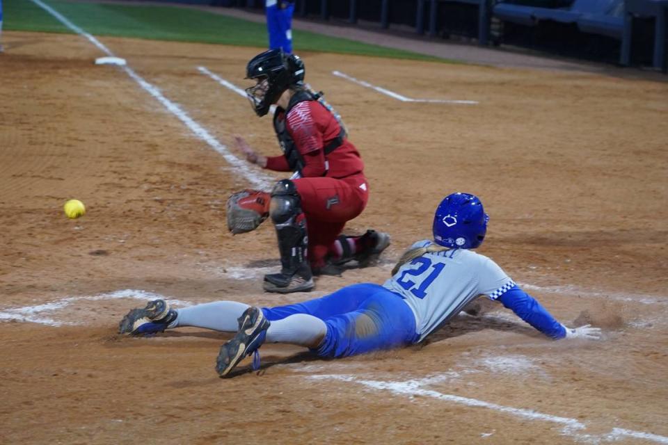 Shortstop Erin Coffel slides home with a Kentucky run during Wednesday night’s win at John Cropp Stadium