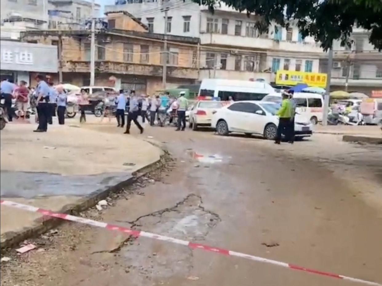 A police cordon is placed in the aftermath of a stabbing attack at a kindergarten in Lianjiang county (Video obtained via REUTERS)