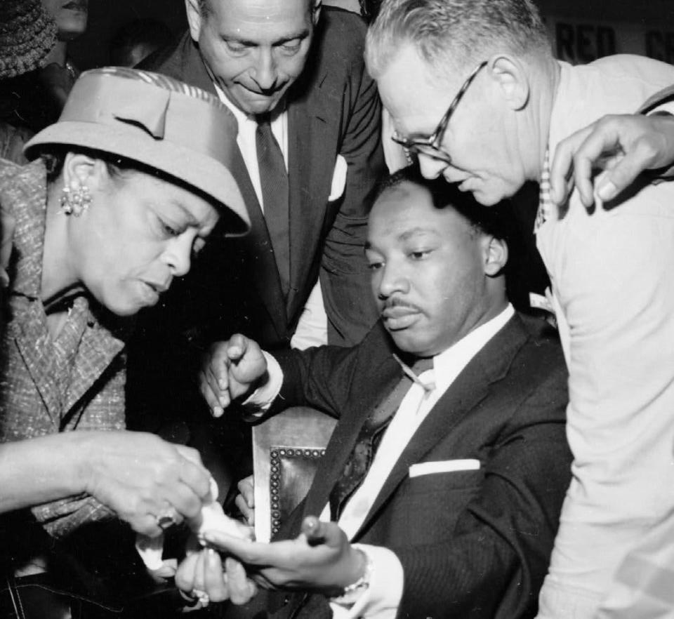 People attending to MLK after stabbing attack