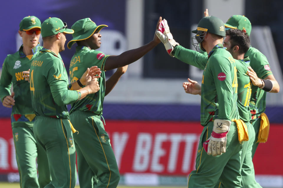 South Africa's Kagiso Rabada, third left, is congratulated by teammates after taking a catch to dismiss West Indies' Evin Lewis during the Cricket Twenty20 World Cup match between South Africa and the West Indies in Dubai, UAE, Tuesday, Oct. 26, 2021. (AP Photo/Kamran Jebreili)