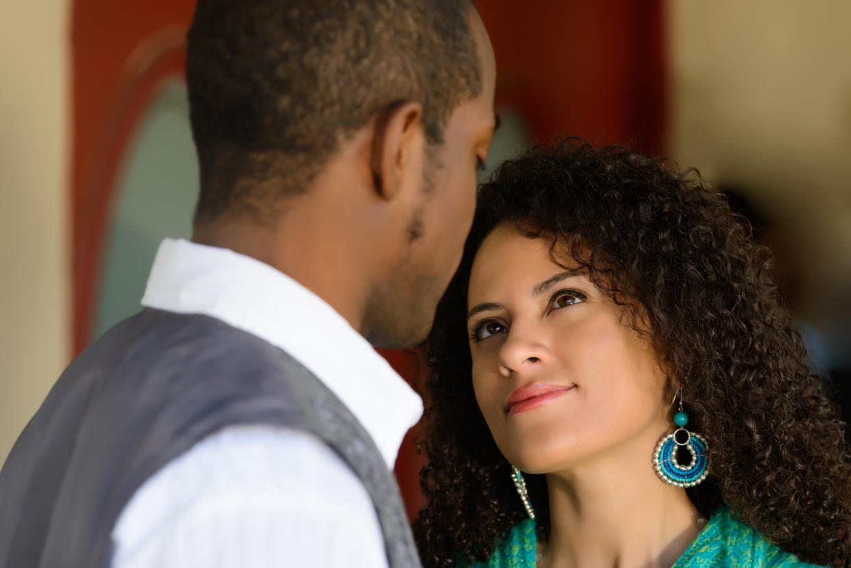 A young couple in conversation, verbal and nonverbal.