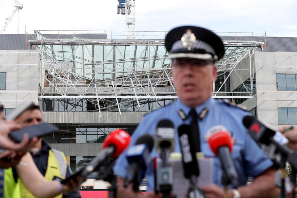 Commander Mike Bell of the WA Police Force speaks to the media in front of the scene of a collapsed building at Curtin University, in Perth.