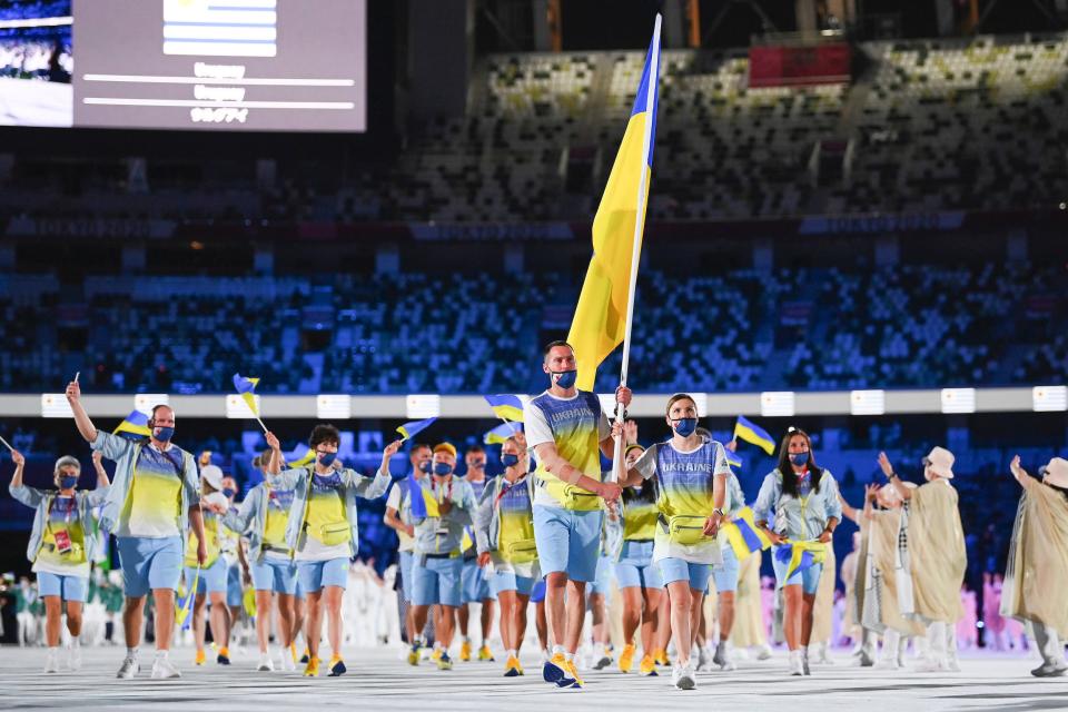 Flag bearers Olena Kostevych and Bogdan Nikishin of Team Ukraine during the opening ceremony.