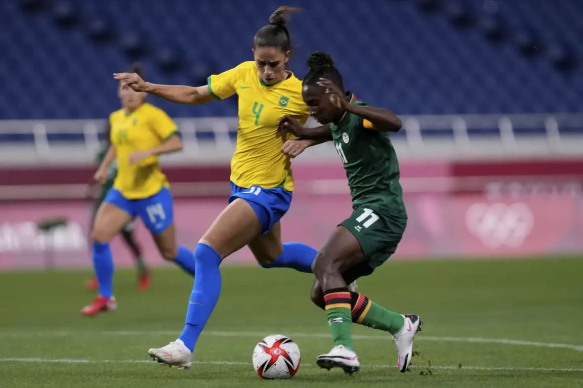 Brazil’s Rafaelle, left, and Zambia’s Babra Banda battle for the ball during a women’s soccer match at the 2020 Summer Olympics, Tuesday, July 27, 2021, in Saitama, Japan. (AP Photo/Martin Mejia)