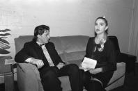 <p>Madonna waits for her cue backstage at the Commitment to Life Celebration in Los Angeles in 1987. The singer is joined by her then husband, actor Sean Penn. </p>