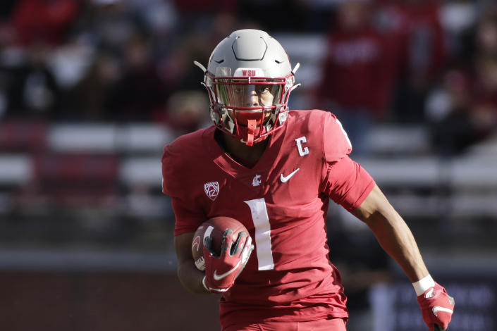 Washington State wide receiver Travell Harris carries the ball during the second half of an NCAA college football game against Oregon State, Saturday, Oct. 9, 2021, in Pullman, Wash. Washington State won 31-24. (AP Photo/Young Kwak)