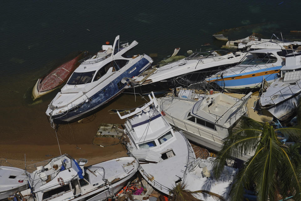 FILE - Boats lay in ruins after the passing of Hurricane Otis in Acapulco, Mexico, Nov. 12, 2023. A busy hurricane season that saw the National Hurricane Center in Miami issue the first ever tropical storm warning for the coast of California and hurricane warnings as far north as Nova Scotia is coming to a close Thursday night, Nov. 30. (AP Photo/Marco Ugarte, File)