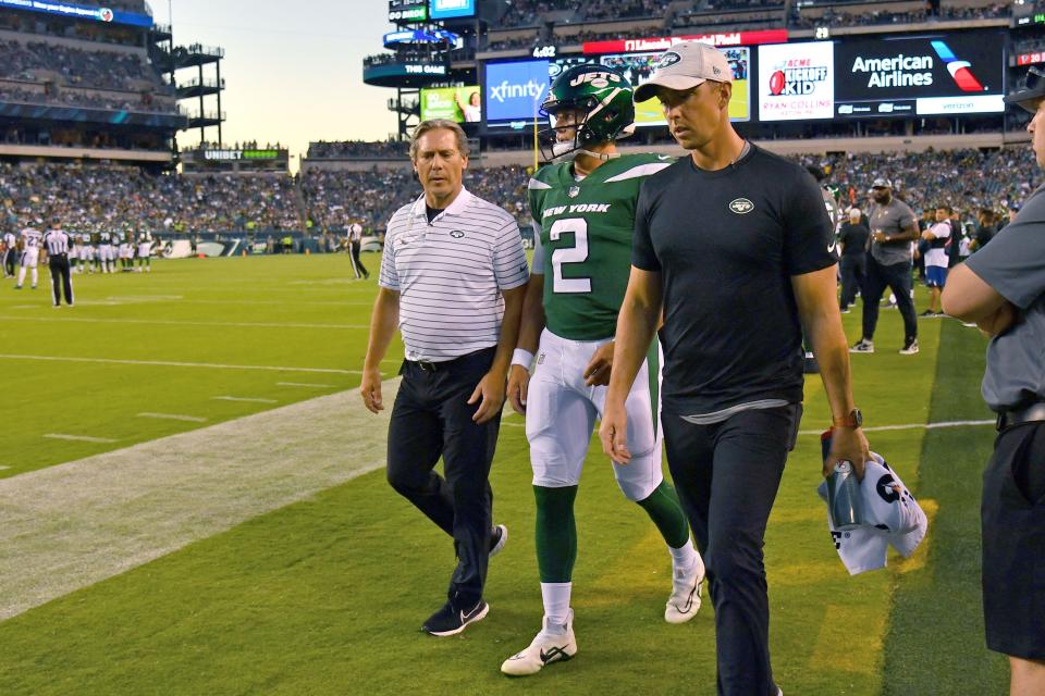 New York Jets quarterback Zach Wilson (2) walks to the locker room after being injured against the Philadelphia Eagles during the first quarter of Friday night's game.