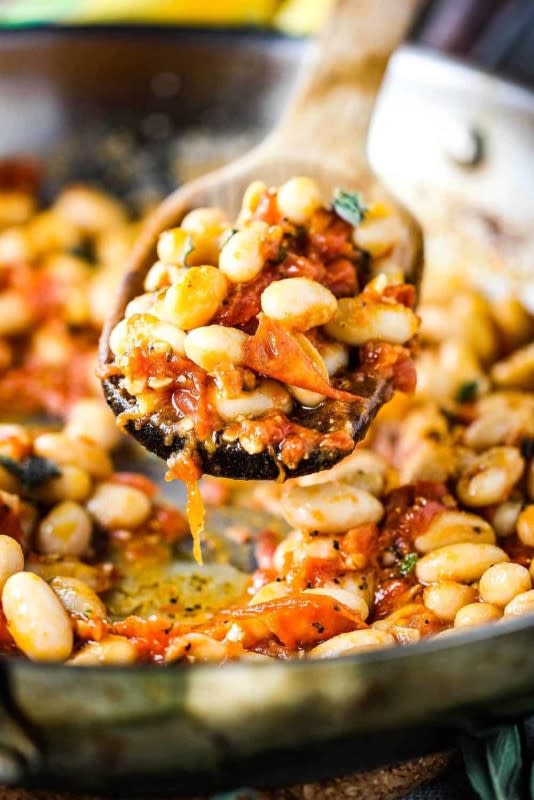 <p>How to Feed a Loon</p><p>This sautéed white beans with garlic, sage and tomatoes couldn't be easier to prepare, but is so full of robust flavor, you won't believe how quickly you'll be getting this to your table. Simple ingredients and wonderful flavors. It is wonderful served warm or at room temperature.</p><p><strong>Get the recipe: <a href="https://howtofeedaloon.com/sauteed-white-beans-garlic-sage-tomatoes/" rel="nofollow noopener" target="_blank" data-ylk="slk:Sauteed White Beans with Garlic, Sage and Tomatoes;elm:context_link;itc:0;sec:content-canvas" class="link "><em>Sauteed White Beans with Garlic, Sage and Tomatoes</em></a></strong></p>