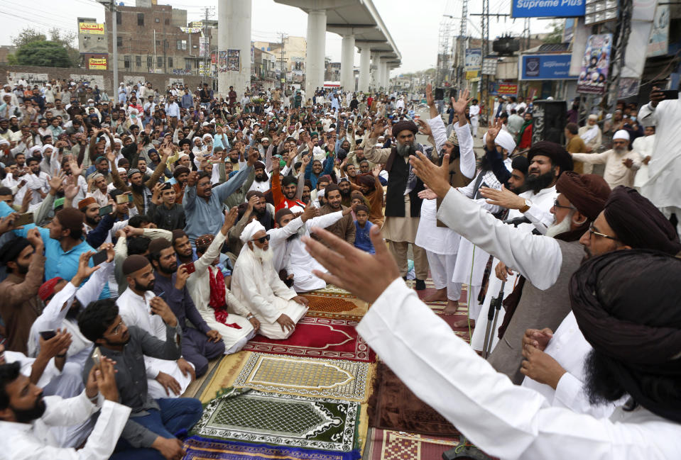 Supporters of Tehreek-e-Labiak Pakistan, a radical Islamist political party, chant slogans during a sit-in protest against the arrest of their party leader Saad Rizvi and demanding to expel the French envoy from the country, in Lahore, Pakistan, Friday, April 16, 2021. Pakistan briefly blocked access to all social media on Friday, after days of anti-French protests across the country by radical Islamists opposed to cartoons they consider blasphemous. (AP Photo/K.M. Chaudary)