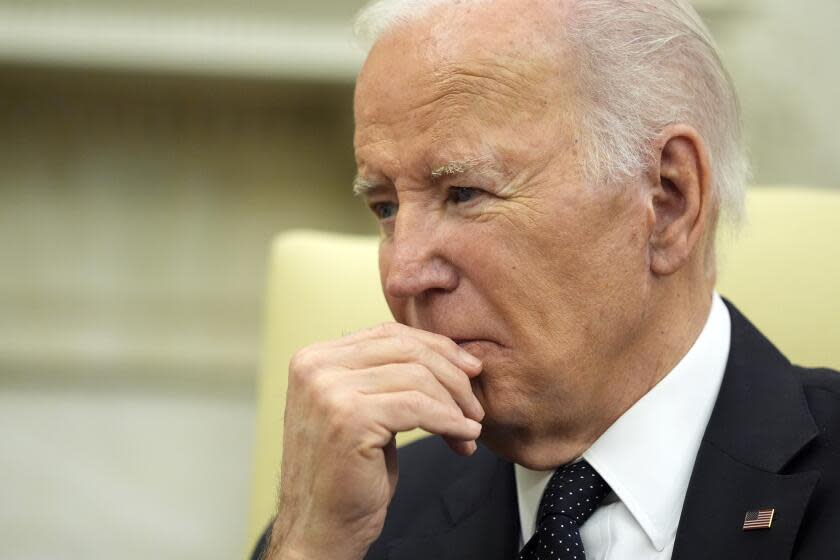 President Joe Biden listens as he meets with Romania's President Klaus Iohannis in the Oval Office of the White House, Tuesday, May 7, 2024, in Washington. (AP Photo/Alex Brandon)