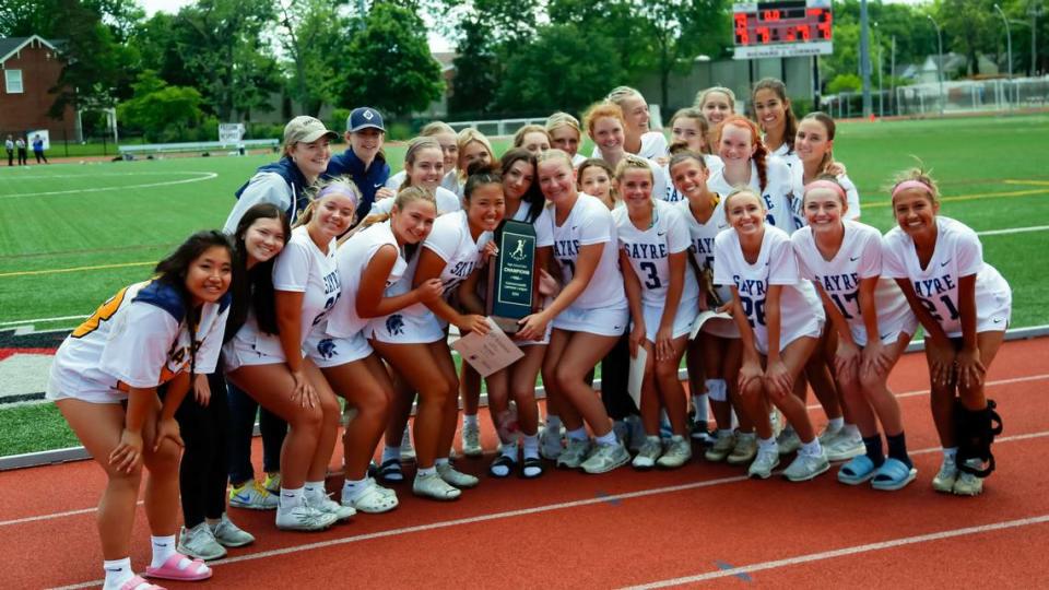 The Sayre Spartans girls lacrosse team posed with their Commonwealth Lacrosse League state championship trophy after defeating Bowling Green 14-3 at Transylvania University’s Pat Deacon Stadium on Saturday. Jared Peck/jpeck@herald-leader.com