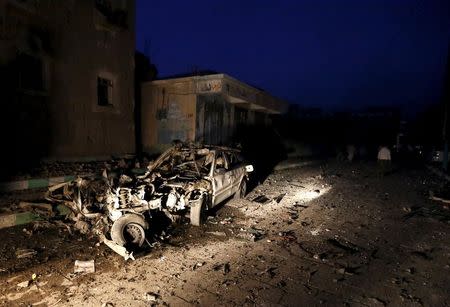 The wreckage of a car is seen at the site of a car bomb attack in Yemen's catpital Sanaa June 17, 2015. REUTERS/Khaled Abdullah