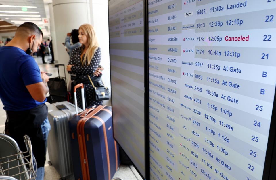 Travelers gather in the Delta terminal at Los Angeles International Airport on June 30. Flight cancellations and delays increased before the busy Fourth of July travel weekend amid airline staffing shortages.