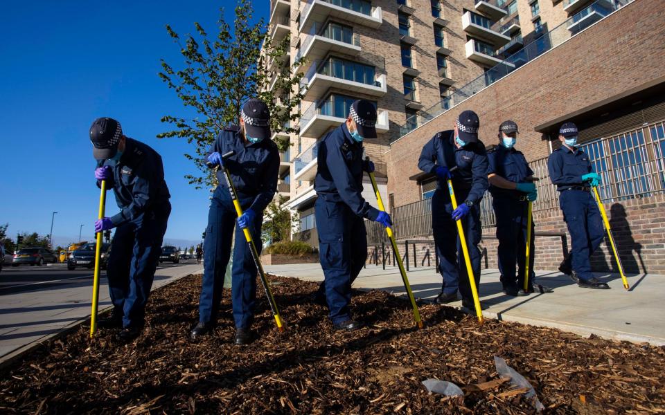 Police search for clues in Pegler Square, Kidbrooke, a short distance away from where Sabina Nessa’s body was found - Jamie Lorriman for The Telegraph