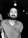 <p>Unsuccessful in his attempts to obtain a mistrial, Charles Manson heads for court in Los Angeles on Aug. 6, 1970, to listen to further cross-examination of the state’s star witness, Linda Kasabian, in his trial for murder in the slayings of actress Sharon Tate and six other people. (Photo: AP) </p>