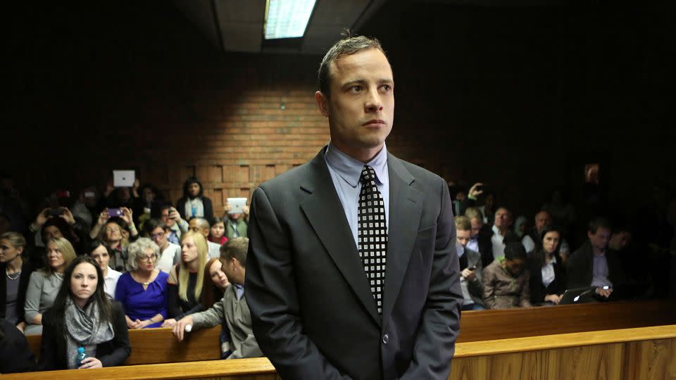 Oscar Pistorius enters the dock before court proceedings at the Pretoria Magistrates court June 4, 2013. - Siphiwe Sibeko/Reuters/File