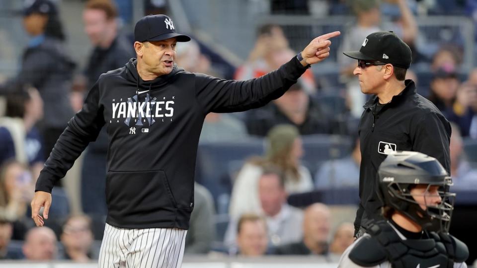 May 25, 2023; Bronx, New York, USA; New York Yankees manager Aaron Boone (17) argues with first base umpire Chris Guccione (68) during the third inning against the Baltimore Orioles at Yankee Stadium.