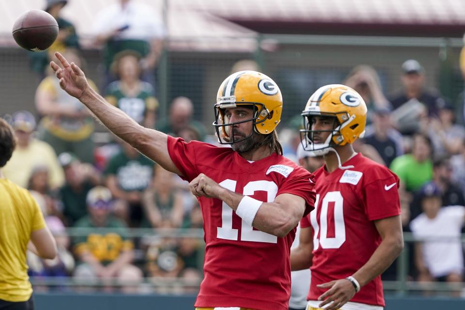 Green Bay Packers' Aaron Rodgers runs a drill at the NFL football team's practice field Wednesday, July 27, 2022, in Green Bay, Wis. (AP Photo/Morry Gash)