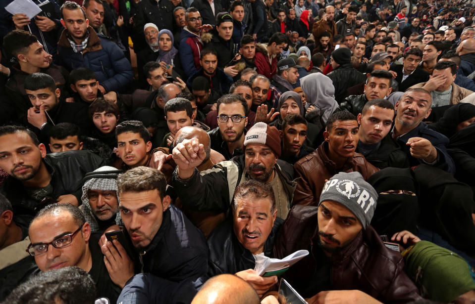 Thousands of Palestinians crowd the Gaza Rafah border crossing with Egypt