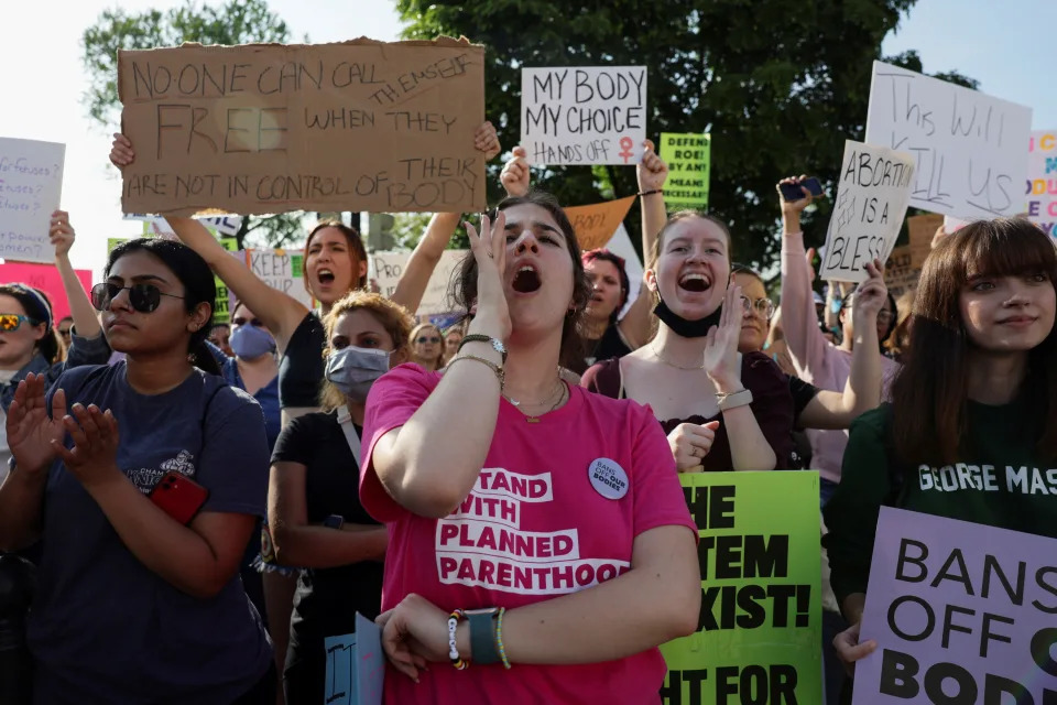 Protesters shout outside the U.S. Supreme Court on Tuesday after the leak of a draft majority opinion written by Justice Samuel Alito preparing for a majority of the court to overturn Roe v. Wade.