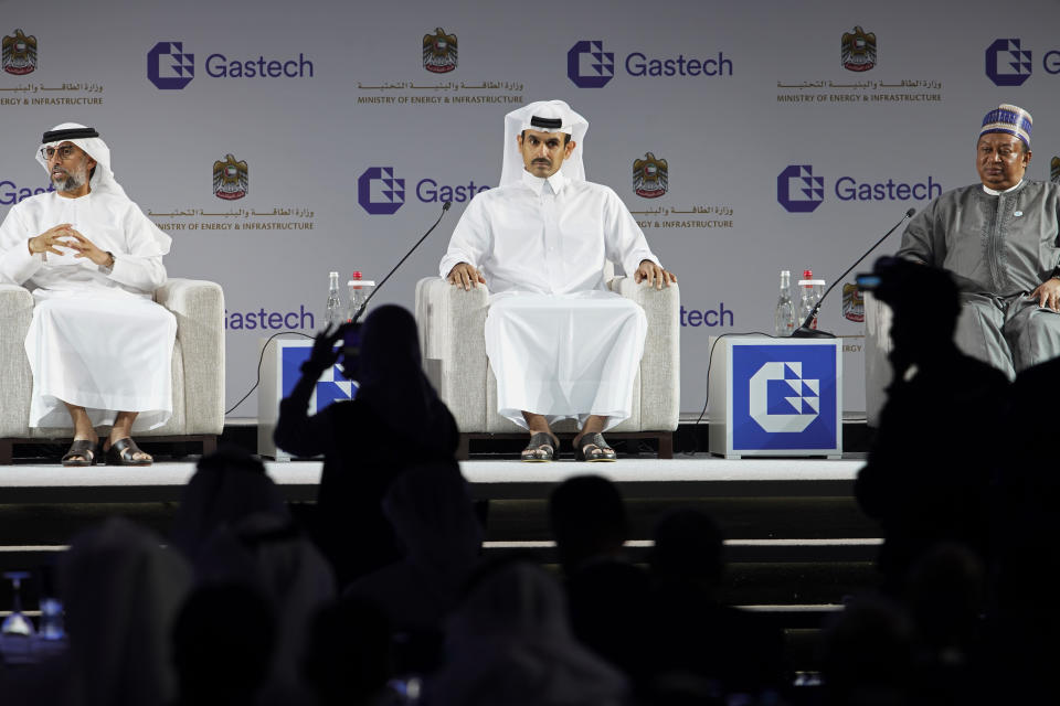 From left, Emirati Energy and Infrastructure Minister Suhail al-Mazrouei, Qatar's Minister of State for Energy Affairs Saad Sherida al-Kaabi and OPEC Secretary-General Mohammad Sanusi Barkindo sit on stage during the Gastech 2021 conference in Dubai, United Arab Emirates, Tuesday, Sept. 21, 2021. Energy officials from Qatar and Turkey, long-standing foes of the United Arab Emirates, descended on Dubai along with hundreds of other executives on Tuesday, flocking to the largest gas expo in the world and the industry's first in-person conference since the pandemic began. (AP Photo/Jon Gambrell)