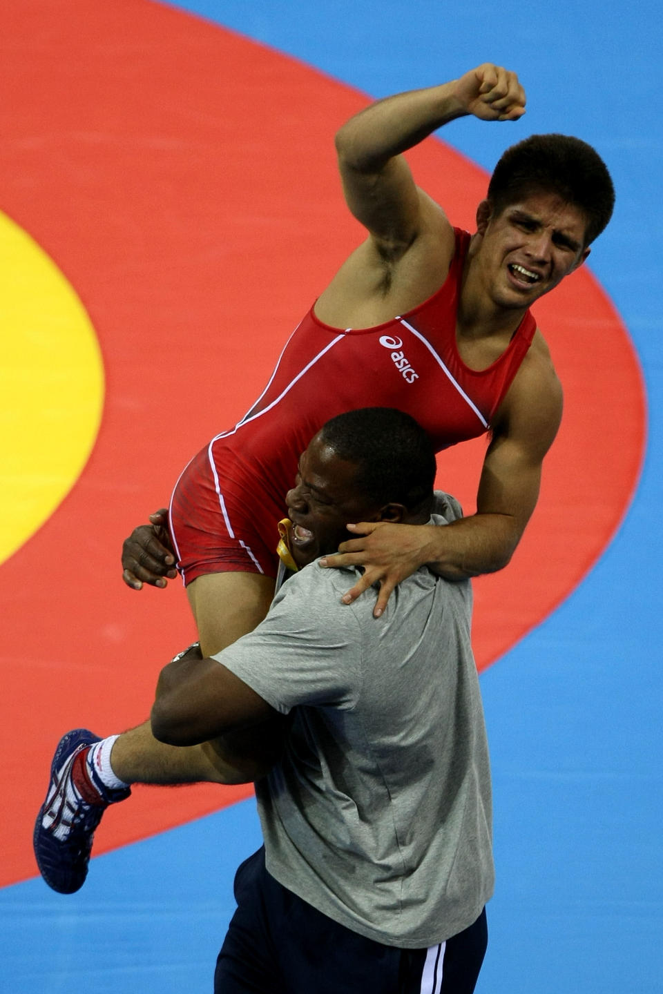 BEIJING - AUGUST 19: Henry Cejudo of the United States celebrates after defeating Shingo Matsumoto of Japan to win the gold medal in the men's 55kg freestyle wrestling event at the China Agriculture University Gymnasium on Day 11 of the Beijing 2008 Olympic Games on August 19, 2008 in Beijing, China. (Photo by Jed Jacobsohn/Getty Images)