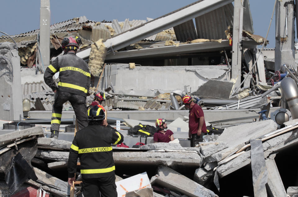 Italian firefighters work amid debris of a collapsed factory in Medolla, Italy, Wednesday, May 30, 2012. A magnitude 5.8 earthquake struck Tuesday that felled old buildings as well as new factories and warehouses in a swath of Italy north of Bologna. The quake, which followed a May 20 magnitude-6.0 quake in the same area, dealt another blow to one of the country's most productive regions at a time when Italy is struggling to restart its economy. (AP Photo/Gregorio Borgia)