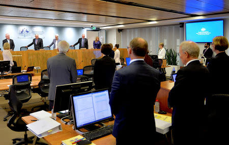 Officials involved with the Royal Commission into Institutional Responses to Child Sexual Abuse stand as the public hearing into the Catholic Church authorities, begins another session in Sydney, Australia, February 6, 2017. Jeremy Piper/Handout via REUTERS