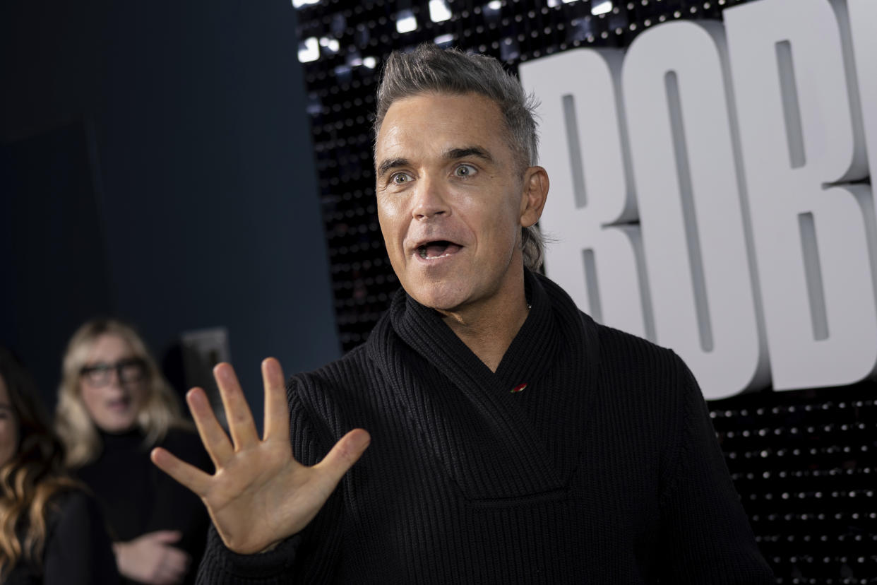 Robbie Williams poses for photographers upon arrival at the premiere for the Robbie Williams documentary