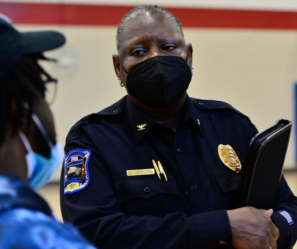 Spartanburg residents speak out against gun violence and how to help young people at the C.C. Woodson Community Center in Spartanburg on Feb. 05, 2022. Deputy Chief Jennifer Kindall of the city of Spartanburg Police Department listens to residents at the event. 