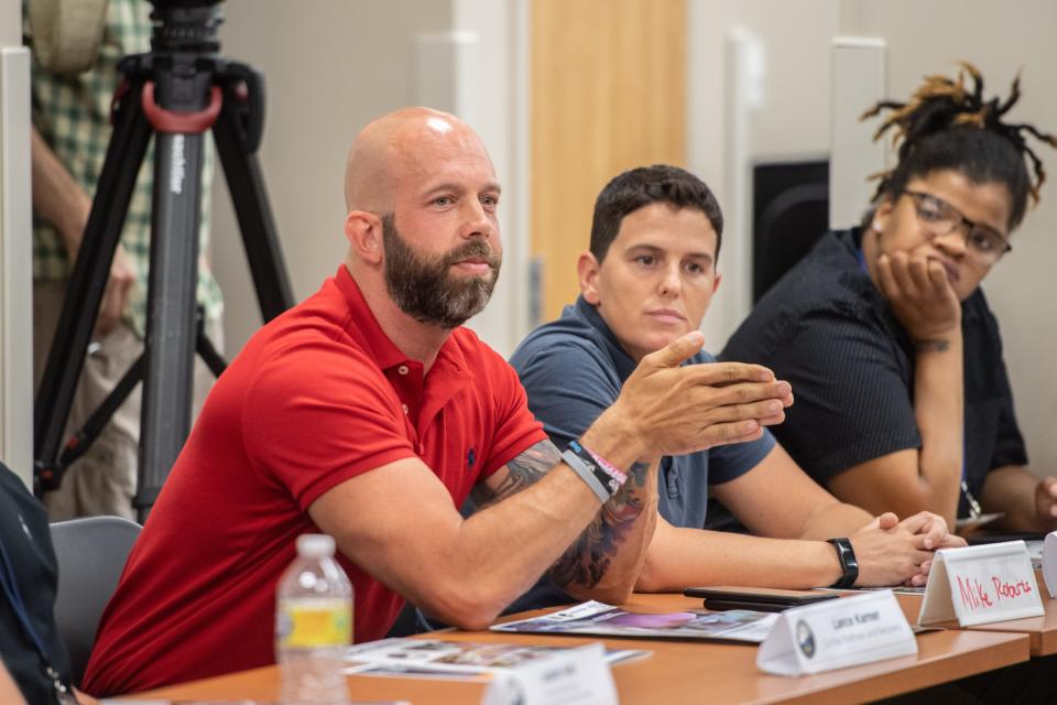 MAT program participant Michael Roberts speaks at a meeting with North Carolina Attorney General Josh Stein and members of other Buncombe County agencies on July 25, 2022.