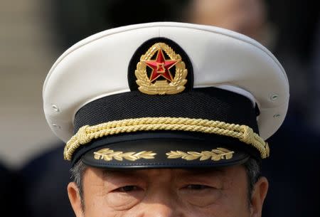 A navy military delegate from the Chinese People's Liberation Army (PLA) arrives at the Great Hall of the People for a meeting during the annual session of China's parliament, the National People's Congress (NPC), in Beijing, China March 4, 2017. REUTERS/Jason Lee