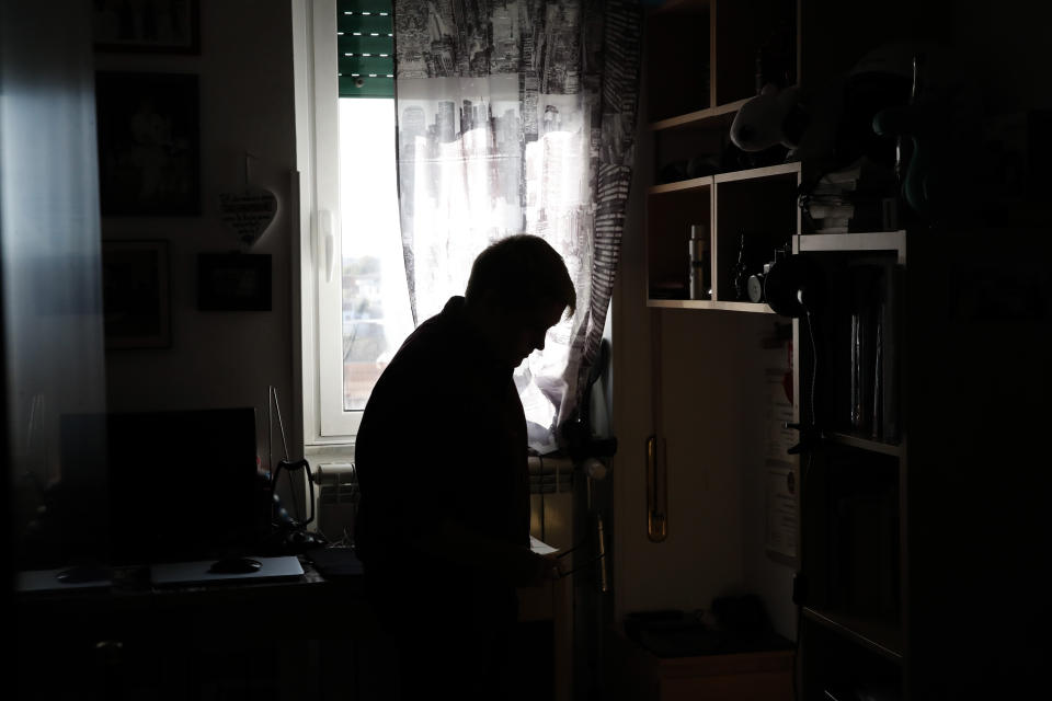 Matteo Coccimiglio in his room in Rome, Thursday, March 18, 2021. Matteo is an 18-year-old student who identifies as a man and is in the process of changing his legal gender from female to male. The Ripetta school of art in Rome - where he studies - recently joined a handful of high schools in Italy that give transgender students the right to be known by a name other than the one they were given at birth. The initiative is meant to create an environment where transgender students feel secure and reflects a growing awareness in Italy of gender dysphoria among teenagers and children. (AP Photo/Alessandra Tarantino)