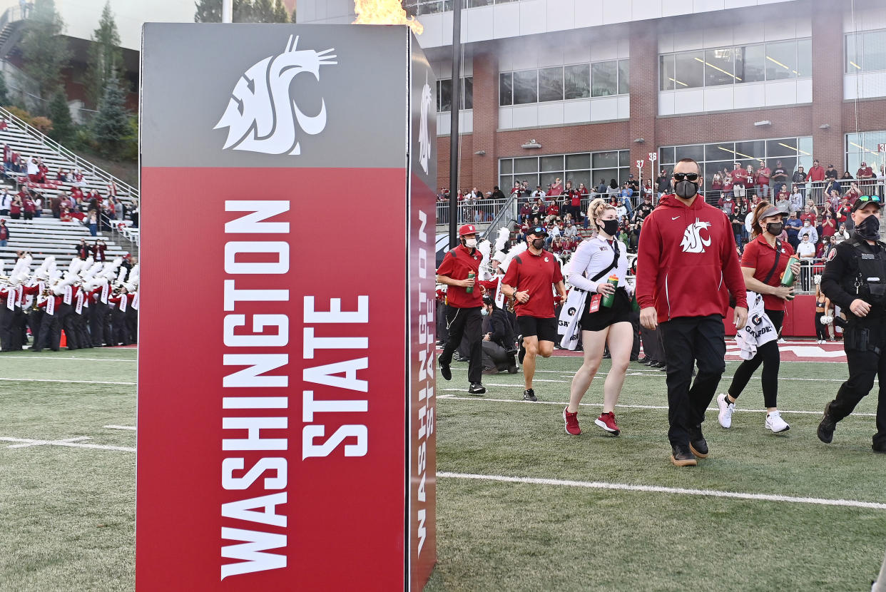 Oct 16, 2021; Pullman, Washington, USA; Washington State Cougars head coach Nick Rolovich walks onto the field before a game against the Stanford Cardinal at Gesa Field at Martin Stadium. Mandatory Credit: James Snook-USA TODAY Sports