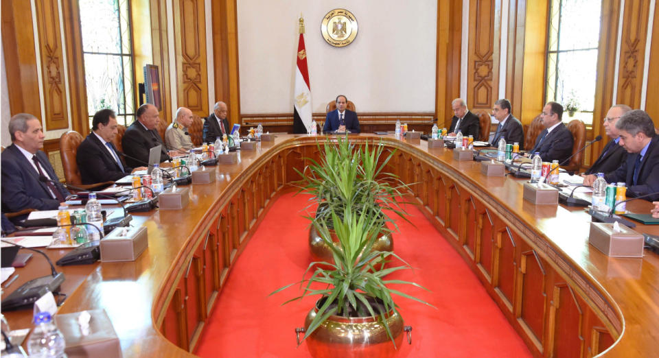 Egyptian President Abdel-Fattah el-Sissi, center, convenes an emergency meeting of the National Security Council, the country’s highest security body, following the early Thursday morning crash of an EgyptAir flight from Paris to Cairo with 66 passengers and crew on board, in Cairo, Egypt, Thursday, May 19, 2016. The council includes the prime minister and the defense, foreign and interior ministers, in addition to the chiefs of the intelligence agencies. (MENA via AP)