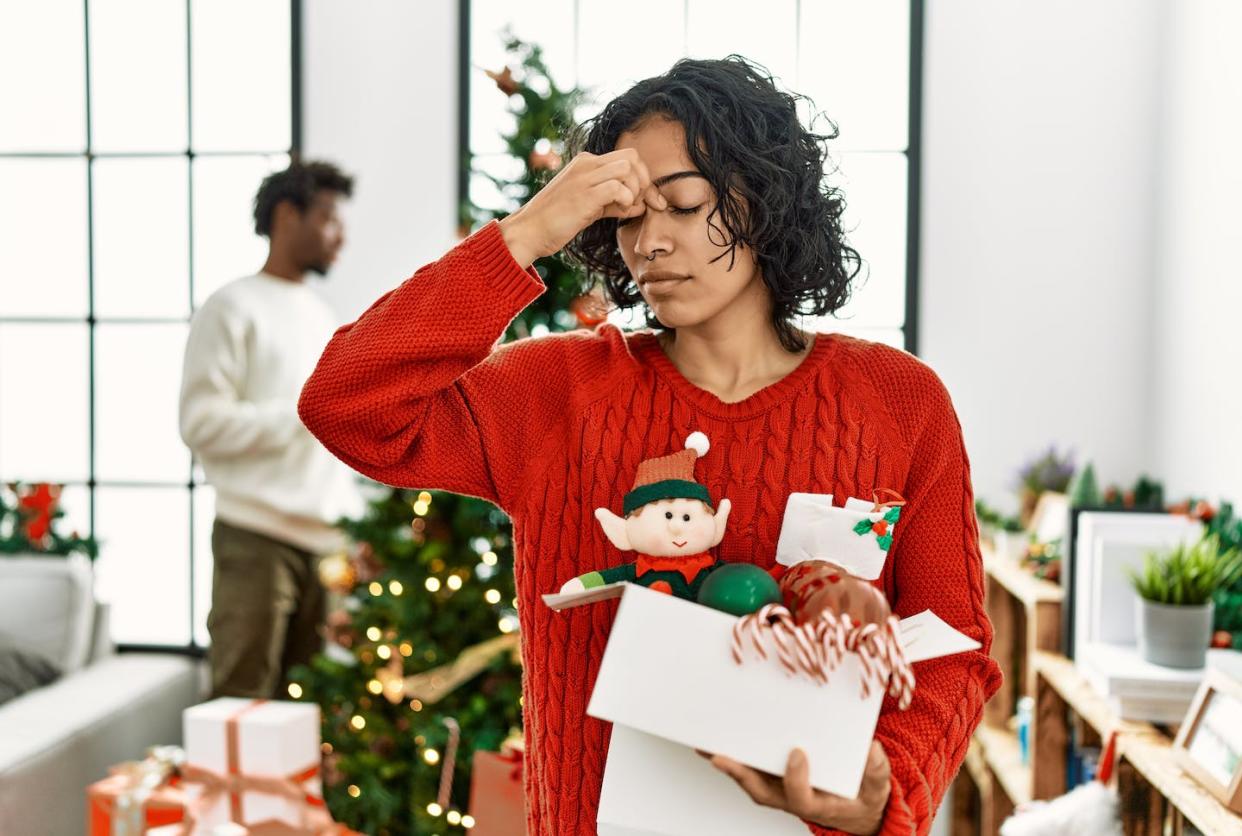 When stress and tension are starting to mount, taking short breaks and deep breaths can help clear your mind. <a href="https://www.gettyimages.com/detail/photo/young-hispanic-woman-standing-by-christmas-tree-royalty-free-image/1333972363?phrase=holiday+stress&searchscope=image%2Cfilm&adppopup=true" rel="nofollow noopener" target="_blank" data-ylk="slk:AaronAmat/iStock / Getty Images Plus;elm:context_link;itc:0;sec:content-canvas" class="link ">AaronAmat/iStock / Getty Images Plus</a>