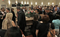 Pall bearers carry the casket of country music star Mindy McCready after a funeral ceremony at the Crossroads Baptist Church in Fort Myers, Fla., Tuesday, Feb. 26, 2013. McCready committed suicide Feb. 17 at her home in Arkansas, days after leaving a court-ordered substance abuse program. (AP Photo/Alan Diaz)