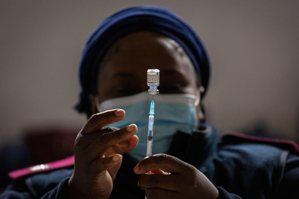 A health worker prepares a dose of the Pfizer-BioNTech Comirnaty branded COVID-19 vaccine at a mass vaccination site at Athlone Stadium in Cape Town, South Africa, August 20, 2021. / Credit:  Photographer: Dwayne Senior/Bloomberg/Getty