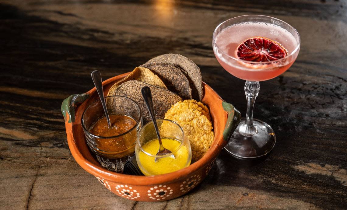 A bowl of freshly made tostadas with house salsas is served with a drink called Almas Perdidas at Cantina Pedregal in Folsom on Tuesday.