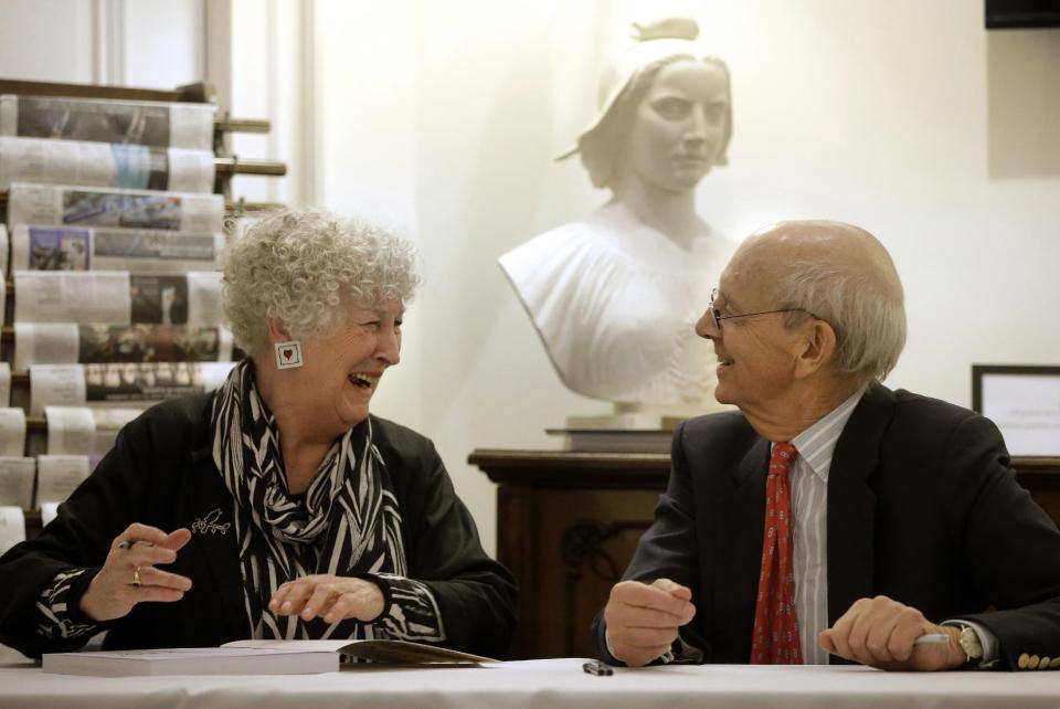 United States Supreme Court Justice Stephen Breyer, right, speaks with artist Noelle Herrenschmidt, left, following a forum called From the Bench to the Sketchbook at the French Cultural Center, Monday, Feb. 13, 2017, in Boston. (AP Photo/Steven Senne)