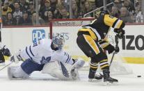 Dec 9, 2017; Pittsburgh, PA, USA; Toronto Maple Leafs goalie Frederik Andersen (31) forces Pittsburgh Penguins center Jake Guentzel (59) wide of the goal during the first period at PPG PAINTS Arena. Mandatory Credit: Don Wright-USA TODAY Sports