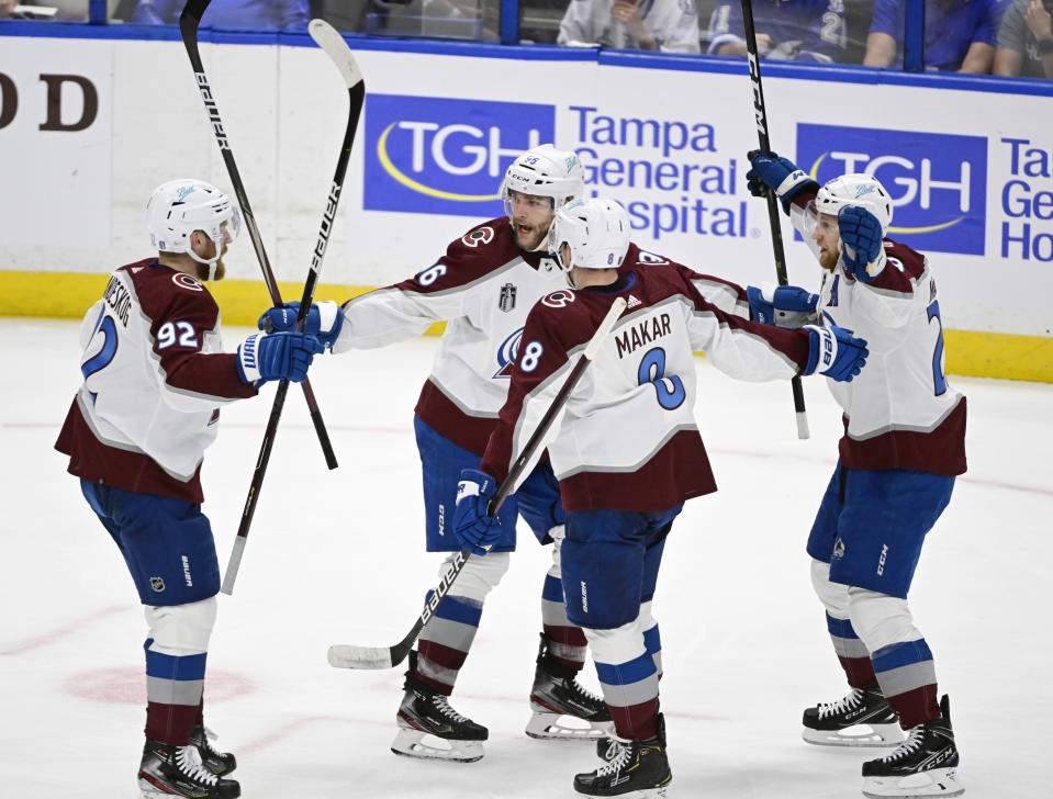 TAMPA, FL - JUNE 22: Colorado Avalanche left wing Gabriel Landeskog (92), Colorado Avalanche right wing Mikko Rantanen (96), Colorado Avalanche defenseman Cale Makar (8) and Colorado Avalanche center Nathan MacKinnon (29) celebrate a goal by McKinnon against Tampa Bay Lightning goaltender Andrei Vasilevskiy (88) in the second period during game four of the NHL Stanley Cup Finals at Amalie Arena June 22, 2022. (Photo by Andy Cross/MediaNews Group/The Denver Post via Getty Images)