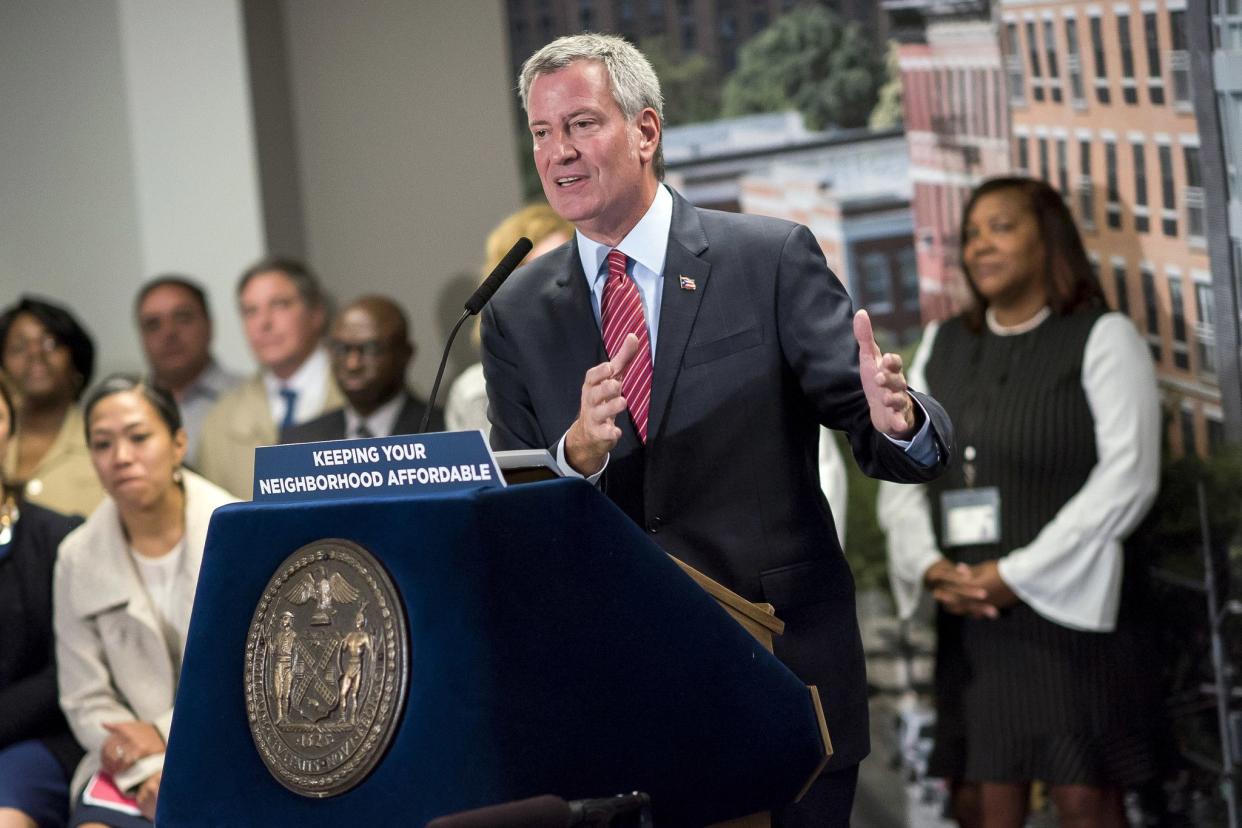 Mayor Bill de Blasio meets tenant Juliette Joseph who recently moved into a newly built affordable apartment Brooklyn on October 24, 2017. A goal of the mayor's has been to build 200,000 units of affordable housing in New York during his time in office, a move that's been praised and criticized; a frequent argument for the latter has been that the move will promote gentrification.