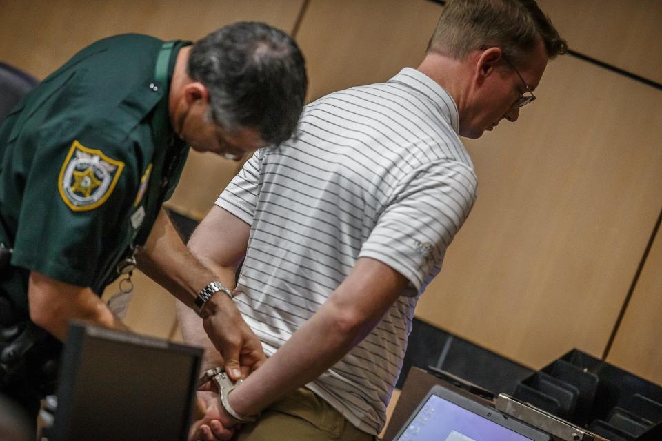 Daniel Norment is taken to jail after being sentenced to prison after pleading guilty in his 'best interest' to unlawful sexual activity with a minor and a sex offense against a student by authority figure.