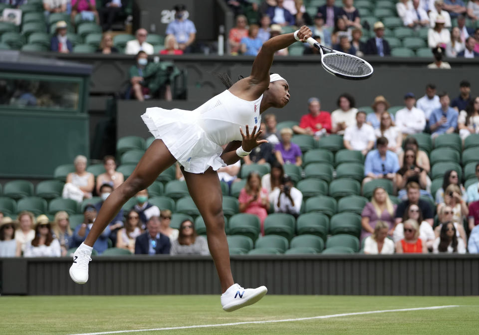 Coco Gauff of the US serves to Russia's Elena Vesnina during the women's singles second round match on day four of the Wimbledon Tennis Championships in London, Thursday July 1, 2021. (AP Photo/Alberto Pezzali)