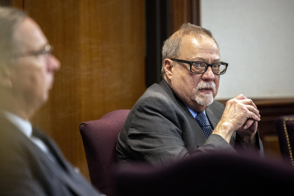 Greg McMichael looks at the gallery during the testimony of his son, Travis McMichael's in the trial of he, his son and William "Roddie" Bryan in the Glynn County Courthouse, Tuesday, Nov. 16, 2021, in Brunswick, Ga. The three are charged with the February 2020 slaying of 25-year-old Ahmaud Arbery. (AP Photo/Stephen B. Morton, Pool)