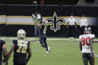 New Orleans Saints wide receiver Tre'Quan Smith (10) prepares to make a catch against the Tampa Bay Buccaneers during the first half of an NFL divisional round playoff football game, Sunday, Jan. 17, 2021, in New Orleans. Smith scored a touchdown on the play. (AP Photo/Brett Duke)